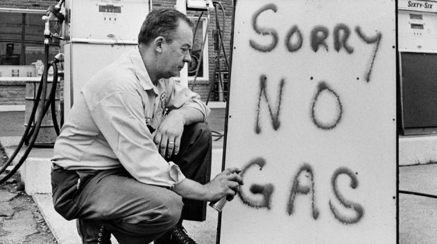 Leon Mill spray-paints a sign outside his Phillips 66 station in Perkasie, Pa., in 1973 to let his customers know he's out of gas. An oil crisis was the culprit, squeezing U.S. businesses and consumers who were forced to line up for hours at gas stations.