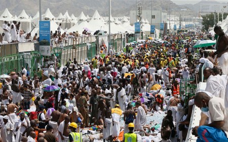 Pilgrims and rescuers gather around where people where people were stampeded and died.  This occurred in Mina, a tent city housing two million adjacent to Mecca on September 24. (AP Photo)
