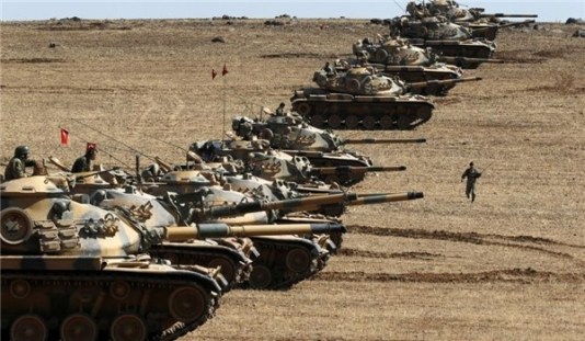 Turkish tanks lining up on the border with Syria prior to August.